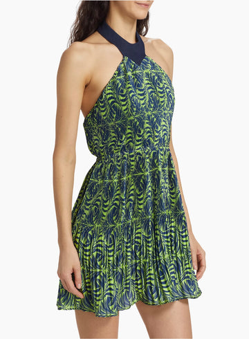 Colorful pleated dress with elegant navy and chartreuse print, featuring a sleeveless halter-style neckline and a flirty, flared skirt.