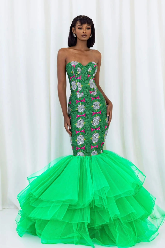 Vibrant green mermaid gown with floral print, dramatic tulle skirt, and strapless bodice from the Claude Kameni fashion brand