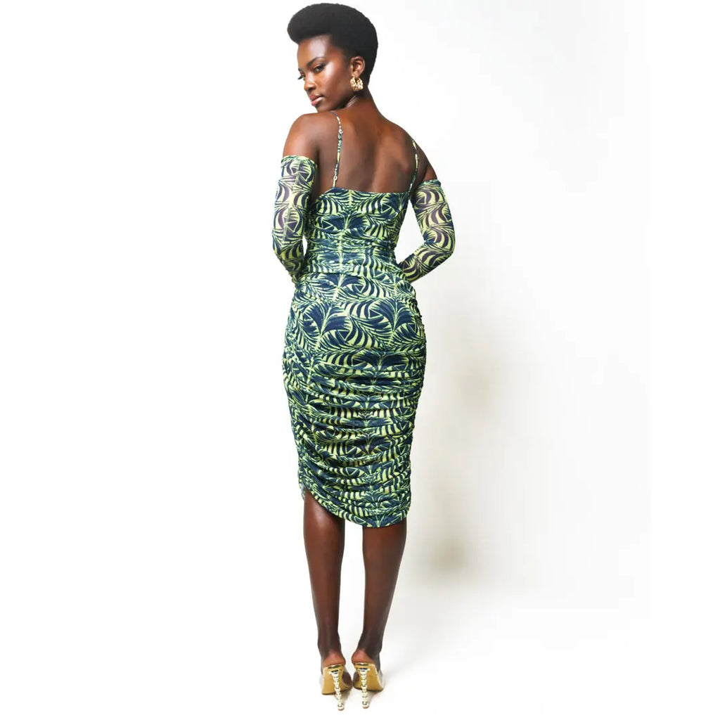 Beautiful African-inspired print dress with long sleeves and a figure-hugging silhouette, showcasing elegant and modern African fashion.